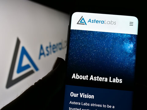 Stuttgart, Germany - 12-03-2022: Person holding cellphnoe with website of US semiconductor company Astera Labs Inc. on screen in front of logo. Focus on center of phone display.