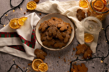 Flat lay photography, Christmas gingerbread cookies sprinkled with powdered sugar with dried...