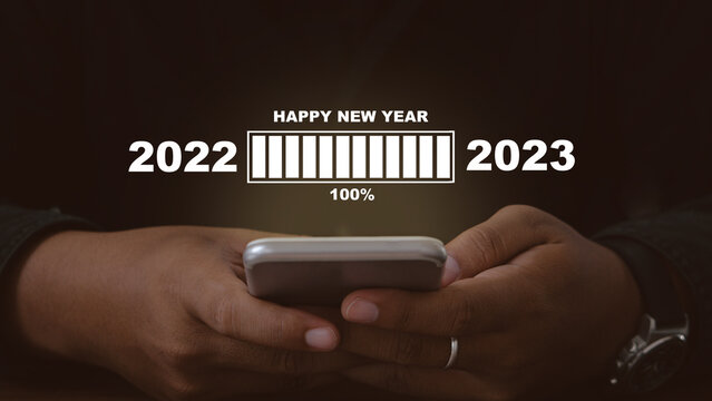 Countdown concept.Happy new year 2023.Manhand waiting loading bar untill 100 percent.Loading year 2022 to 2023.
