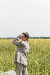 An Asian model poses in a field of yellow flowers for a clothing brand, polyethylene is the main...