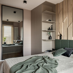 Stylish bedroom with mirror