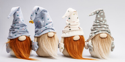 WEB banner. Bearded cute gnomes in caps on a light background. Handmade soft toy. Home decor. Copy space