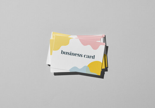 Business Card Mockup Scattered in a Pile With Custom Background