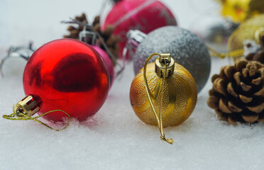 Christmas tree toys on white snow