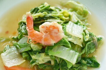 stir fried slice green Chinese cabbage and carrot with shrimp on plate   