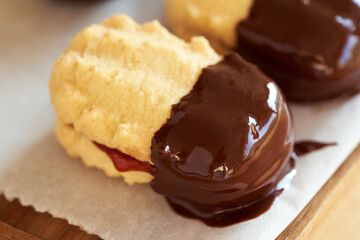 Traditional Christmas cookie filled with marmalade and dipped in chocolate
