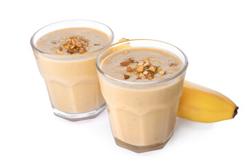 Tasty banana smoothie with almond and fresh fruit on white background