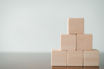Banner,wallpaper,background,mock up concept.,A pyramid shaped of blank wooden cubes for put icon,word,icon  over white background with copyspace.,Flat lay top view mock-up item concept.