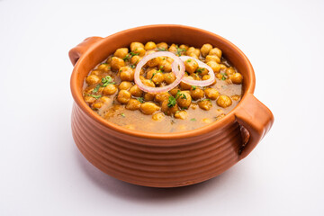 Punjabi Chana Masala or Chole Masala, is an authentic North Indian style curry made with chickpeas - obrazy, fototapety, plakaty