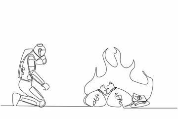 Continuous one line drawing astronaut kneeling and watching money bag burning up. Global financial crisis impacted space industry. Cosmonaut outer space. Single line graphic design vector illustration