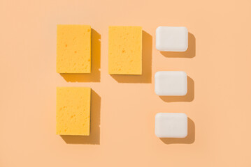 Geometric mockup layout square pattern sponge for washing and bar of soap. Beige background.