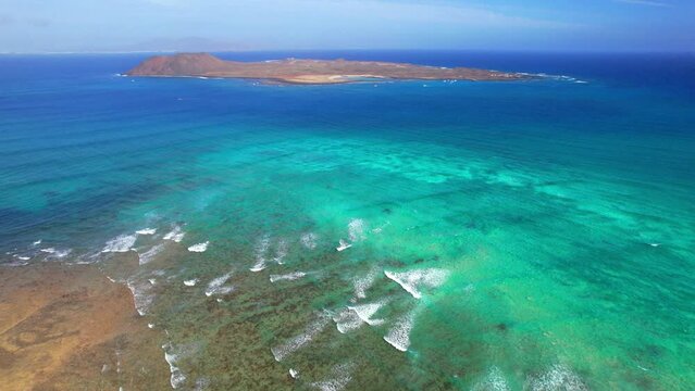Corralejo beach and view of Lobos island. aerial drone video .Fuerteventura Canary islands of Spain
