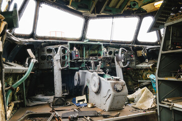 Fototapeta na wymiar Cabin of an abandoned aircraft, the interior of the ship