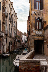 Fototapeta na wymiar Venice, its characteristic architecture and its colours. The glimpse of an internal channel.