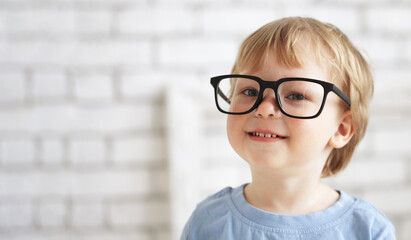 smart boy with big glasses