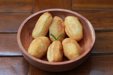 Comro or combro, a traditional Javanese snack made of deep fried grated cassava filled with a savory mix of oncom or fermented soy bean cake and chili