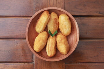 Comro or combro, a traditional Javanese snack made of deep fried grated cassava filled with a savory mix of oncom or fermented soy bean cake and chili