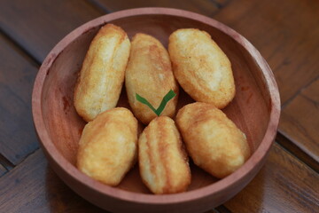 Comro or combro, a traditional Javanese snack made of deep fried grated cassava filled with a savory mix of oncom or fermented soy bean cake and chili