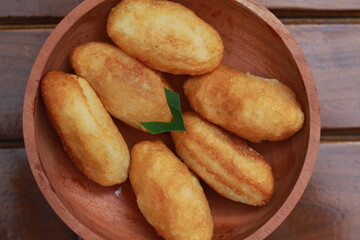 Comro or combro, a traditional Javanese snack made of deep fried grated cassava filled with a savory mix of oncom or fermented soy bean cake and chili