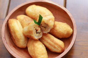 Comro or combro, a traditional Javanese snack made of deep fried grated cassava filled with a savory mix of oncom or fermented soy bean cake and chili