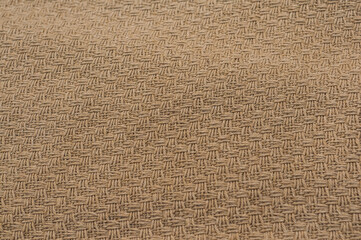 Texture of fabric for furniture of rich brown color. noisy structure