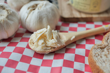 top view of garlic spread on a spoon 