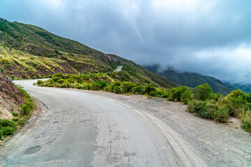 winding mountain roads in the Andes Mountains with a sky overcast with clouds. 