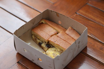 a dish called sweet martabak topped with raisins and bananas tastes sweet and is filling. made from flour dough. served warm. Food concept photo.