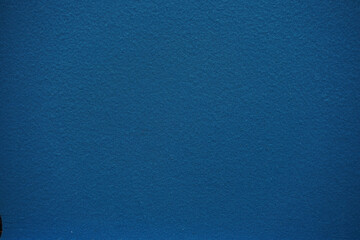 Blue corduroy background. High-resolution dark blue fabric texture that can be used as a pattern and tiled seamlessly. Blue Ribbed Corduroy Texture Background.