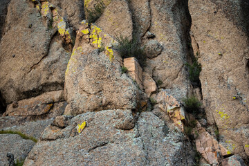 Rocky wall closeup. Big rock boulders Texture of the mountain cliff.