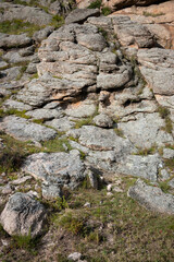 Rocky wall closeup. Big rock boulders Texture of the mountain cliff.