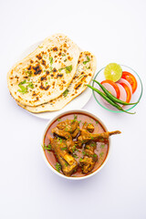 Fototapeta na wymiar Indian style Mutton OR Gosht Masala OR indian lamb meat rogan josh served with Naan