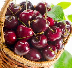 Dark red cherries in a wicker basket