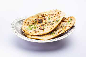 Tandoori naan, Indian Tandoori roti or flat bread served in a plate, isolated - obrazy, fototapety, plakaty