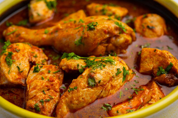 Red Chicken Curry or murgh Masala or korma with prominent Leg Piece