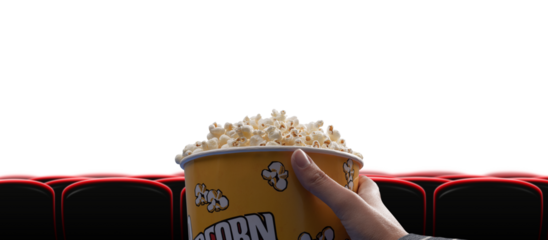 Woman eating popcorn at the cinema