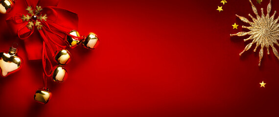 Christmas greeting card or holidays banner design; Golden Christmas tree decoration on red background; Copy space