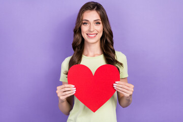 Photo of young smiling good mood brunette hair lady hold big red paper love symbol want gift from her boyfriend isolated on violet color background