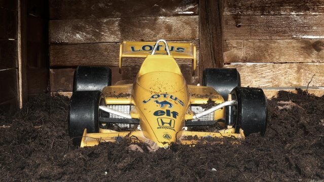 Madrid, Spain; 12-12-2022: Model of an old Formula 1 car Lotus 99T  from 1987 that Ayrton Sennal was driving abandoned in a barn with damage caused by the passage of time
