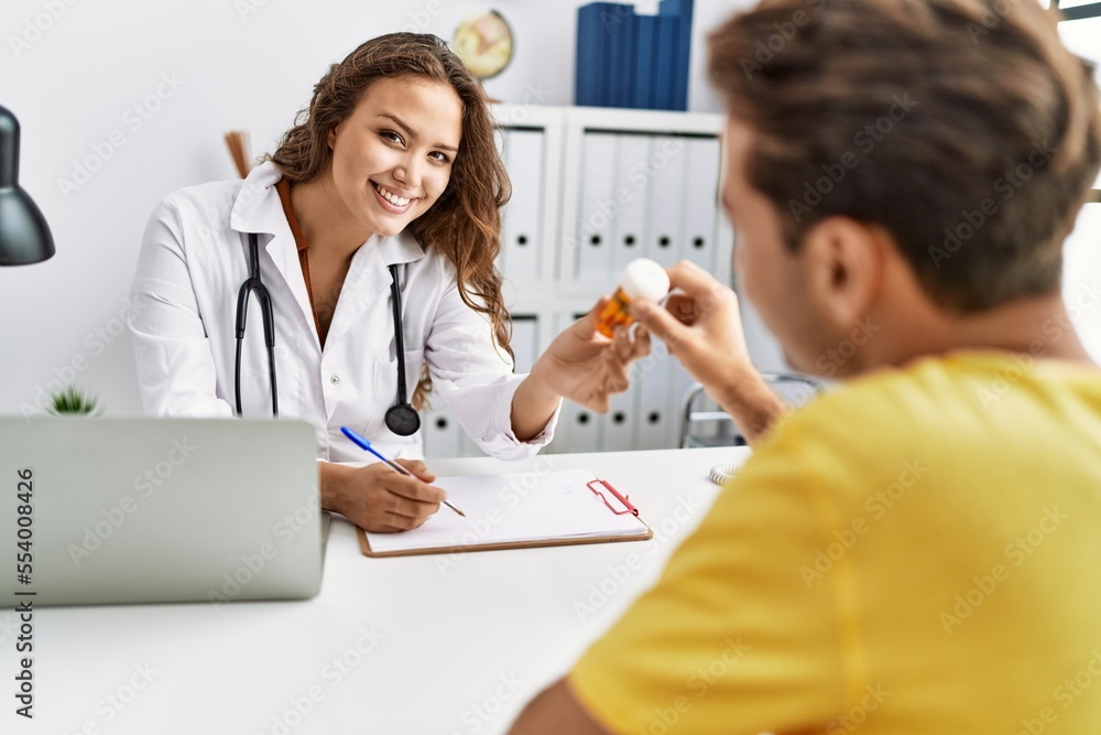 Canvas Prints man and woman having doctor visit prescribing pills at clinic