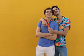 Happy young couple embraces. Two men enjoy outside..