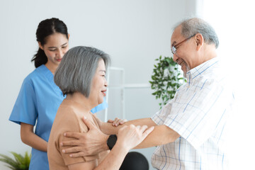 Obraz premium Portrait of happy senior couple with wife embracing husband, nurse doctor senior care caregiver help assistance retirement at home nursing, or hugging after sick in hospital