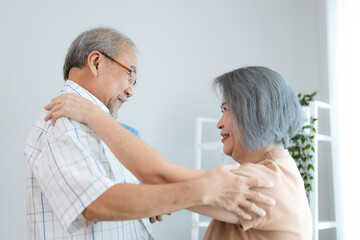 Fototapeta premium Portrait of happy senior couple with wife embracing husband, nurse doctor senior care caregiver help assistance retirement at home nursing, or hugging after sick in hospital