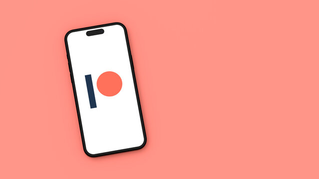 PatreonLogo on Mobile Phone Screen on Red Background with Copy Space