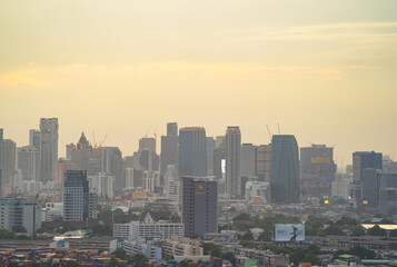 Aerial view of Bangkok Downtown Skyline, Thailand. Financial district and business centers in smart urban city in Asia. Skyscraper and high-rise buildings at sunset.