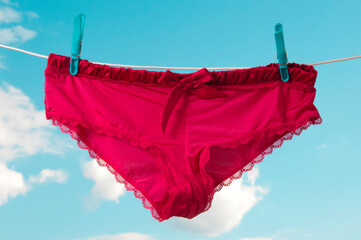 pink female underwear on a clothesline