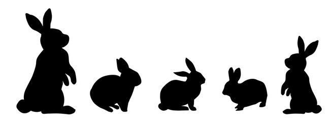Rabbit silhouette in the meadow. The rabbit symbolizes the year 2023.