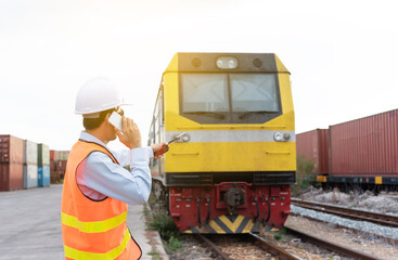 The engineer is controlling a freight train.