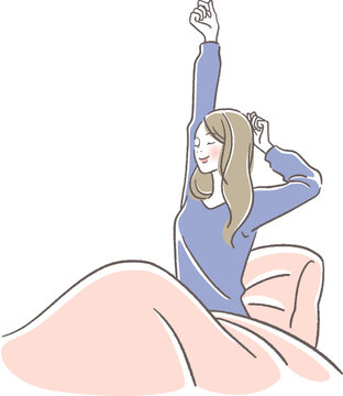 ベッドで伸びをする女性