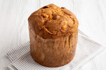 Homemade Italian Panettone with Raisins and Large Pieces of Candied Fruit, side view.